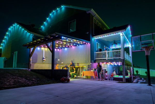 Bright lights in the backyard with Trimlight in blue colors.